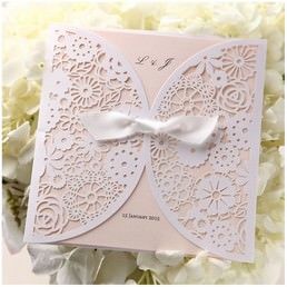 Mesmerizing array of flowers in die cut finish with a dainty bow center draping a light pastel coloured insert card in raised ink
